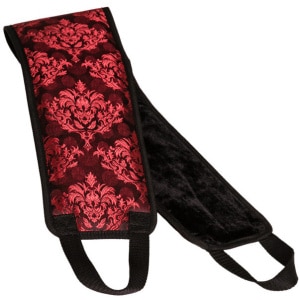 red and black patterned positing strap with fuzz on the other side