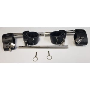 purple leather wrist and ankle cuffs with a fur lining, silver locks and keys. metal rods connecting to the cuffs and a separate rod with pins